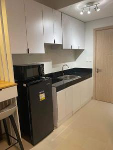 Kuchyň nebo kuchyňský kout v ubytování G108 Cheer Residences