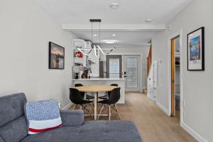 a living room with a couch and a table at 2BR 2BA Harvie Heights Townhouse retreat with views in Canmore