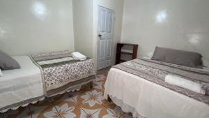 Postel nebo postele na pokoji v ubytování Hotel Marjenny