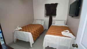 Postel nebo postele na pokoji v ubytování Hotel Marjenny