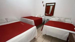 Postel nebo postele na pokoji v ubytování Hotel Marjenny