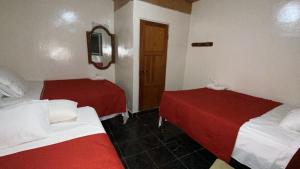 Postel nebo postele na pokoji v ubytování Hotel Marjenny