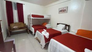 Postel nebo postele na pokoji v ubytování Hotel Marjenny