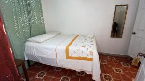 Postel nebo postele na pokoji v ubytování Hotel Marjenny