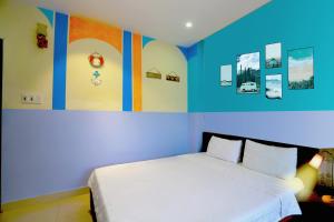 Postel nebo postele na pokoji v ubytování Smile hotel
