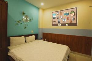 Postel nebo postele na pokoji v ubytování Smile hotel