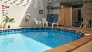 Bazén v ubytování Lime Hotel nebo v jeho okolí