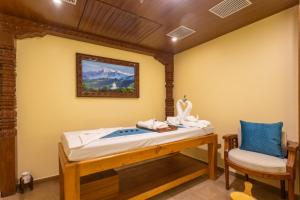 Voodi või voodid majutusasutuse Aarya Hotel and Spa toas