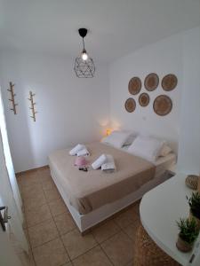 Postel nebo postele na pokoji v ubytování Petala House