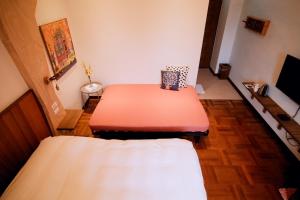 Giường trong phòng chung tại Yun Tien Feng Chuan B&B