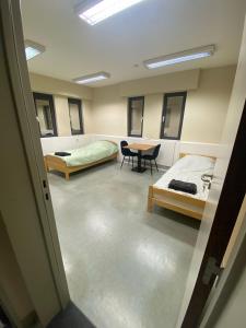 Katil atau katil-katil dalam bilik di Rooms Exit E40