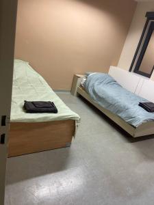 Katil atau katil-katil dalam bilik di Rooms Exit E40