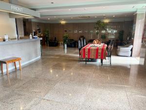 a dining room with a table and chairs in a building at Hotel Yamadaso - Vacation STAY 10209v in Nago