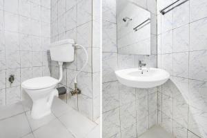 a bathroom with a toilet and a sink at Super Collection O Bhubaneswar City Center in Bhubaneshwar