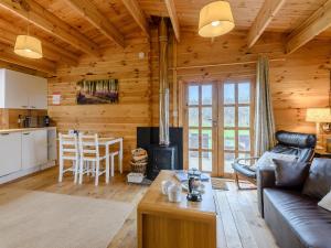 a living room with a couch and a stove at Halfmoon Wood - Ukc2194 in Caunton