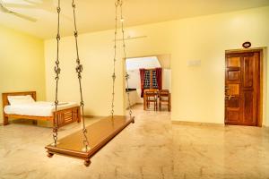 Postel nebo postele na pokoji v ubytování Bairava Bliss Inn - Rameswaram