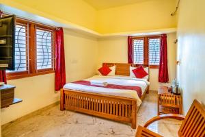 Postel nebo postele na pokoji v ubytování Bairava Bliss Inn - Rameswaram