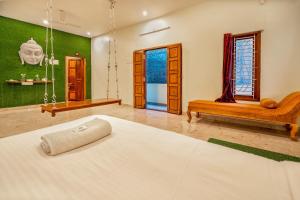 Postel nebo postele na pokoji v ubytování Bairava Bliss Inn - Rameswaram