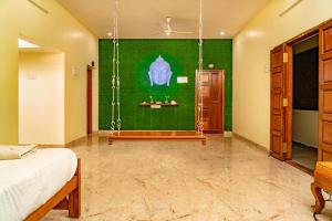 Postel nebo postele na pokoji v ubytování Bairava Bliss Inn - Rameswaram