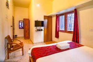 Postel nebo postele na pokoji v ubytování Bairava Bliss Inn - Rameswaram
