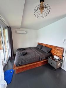 a bedroom with a bed and a ceiling fan at Shark Bay room Turtle in Koh Tao
