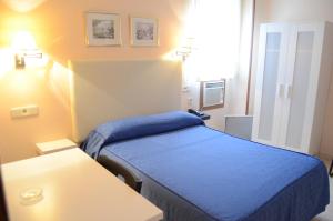 Ein Bett oder Betten in einem Zimmer der Unterkunft Hotel Legazpi