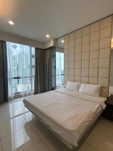Ένα ή περισσότερα κρεβάτια σε δωμάτιο στο Robertson suites At Bukit Bintang South Lobby