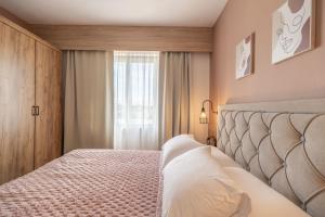 Posteľ alebo postele v izbe v ubytovaní Paradisio Baby & Kinder Hotel