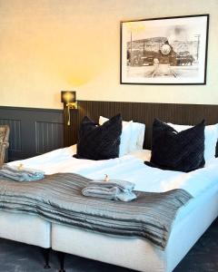 Postel nebo postele na pokoji v ubytování Central Hotellet Tierp