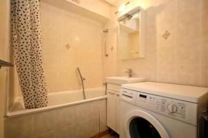 a white washing machine in a bathroom with a sink at Résidence Les Houches Villages - Houches Village B23 MAE-6424 in Les Houches