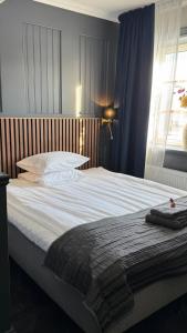 Postel nebo postele na pokoji v ubytování Central Hotellet Tierp