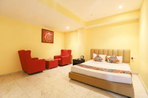 Ένα ή περισσότερα κρεβάτια σε δωμάτιο στο FabHotel Chamiers Park - Nandanam