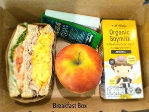 a box with an apple and a sandwich and some food at Icon Dome Bangkok in Bangkok +10 photos