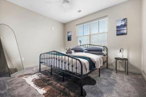 a bedroom with a bed and a window at IRIE Living Restore Kg 2Bd Gym Pool, BRAND NEW! in Whitestown