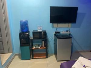 a room with a tv and other items in a room at Bourbon street condo in Angeles