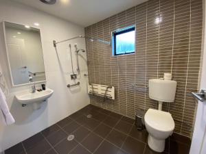 a bathroom with a toilet and a sink at Blues Air 3A - Thredbo in Thredbo