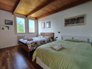 Postel nebo postele na pokoji v ubytování B&B Monte Adone