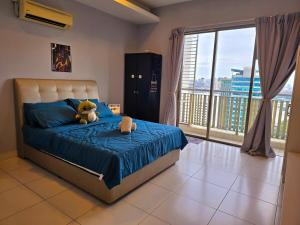 a bedroom with a bed with a teddy bear on it at Comfy Studio Neo Damansara Ikea Ikano 2Pax1CP in Petaling Jaya +74 photos