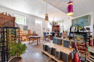 a room filled with lots of bottles of wine at Kräuterküche in Maring-Noviand