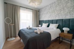 Posteľ alebo postele v izbe v ubytovaní Aparthotel Weissa 7