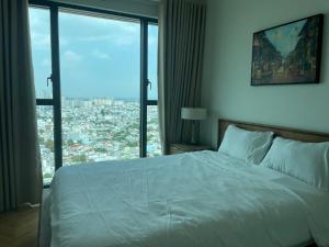 a bedroom with a large bed and a large window at 1Br Feliz apartment ThanhMyLoi in Ho Chi Minh City +27 photos