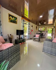 a living room with two couches and a television at NANAS House in Tigre