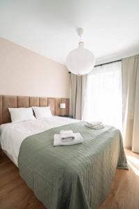 Posteľ alebo postele v izbe v ubytovaní Aparthotel Weissa 7