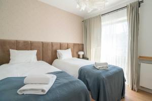 Posteľ alebo postele v izbe v ubytovaní Aparthotel Weissa 7