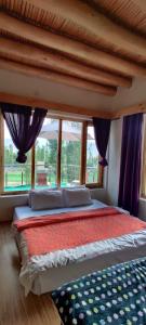 Postel nebo postele na pokoji v ubytování Morning Sky Homestay