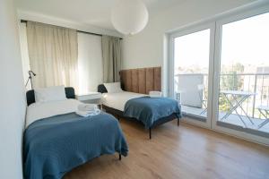 Posteľ alebo postele v izbe v ubytovaní Aparthotel Weissa 7