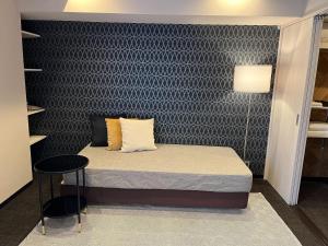 Voodi või voodid majutusasutuse INOVA Kanazawa toas