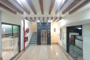 a hallway with a staircase in a house at The Vrindavan Inn in Vrindāvan