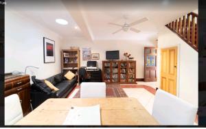 a living room with a couch and a table at Beautiful & Peaceful 2 bedroom villa in Northbridge in Perth
