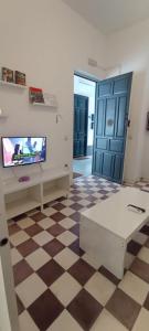 Telewizja i/lub zestaw kina domowego w obiekcie Casas y Patios de Sevilla